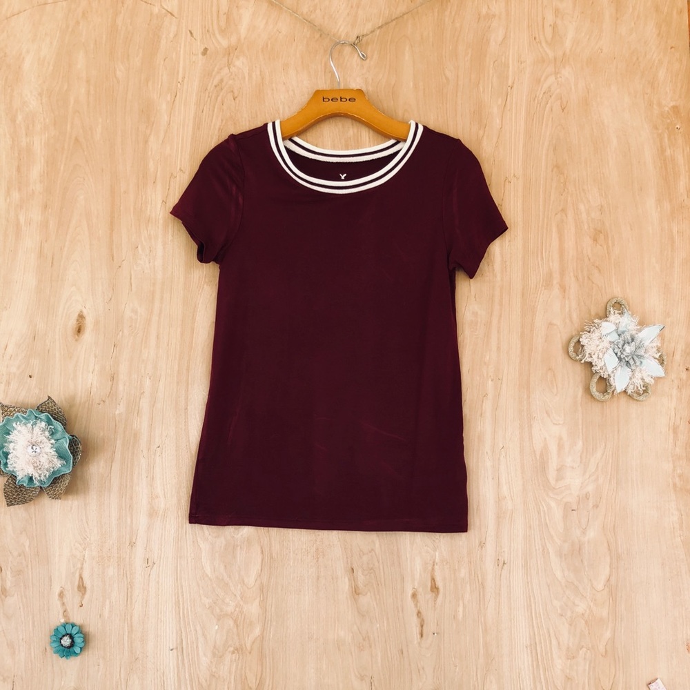 A burgundy, soft, well fit, short sleeve shirt.